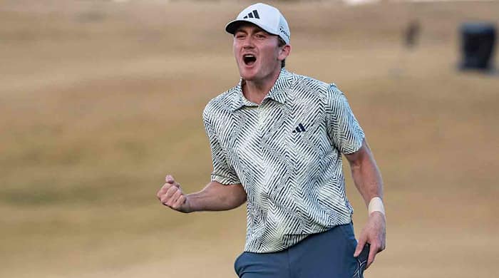 Nick Dunlap celebrates after sinking a putt on the 18th green to win the 2024 American Express at PGA West in La Quinta, Calif.